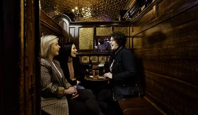 Group of friends around table at McConville's Bar Portadown