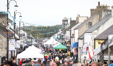 Crowds and stalls fill the main street in Bushmills