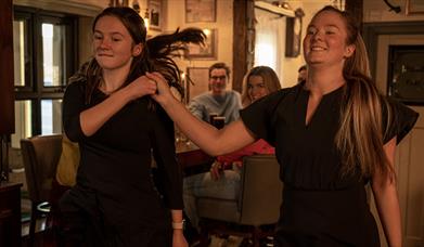 Two dancers doing a demonstration as part of the Ceili & Craic experience at The Ponderosa.