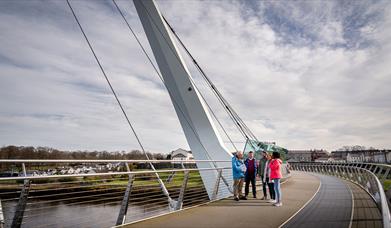 Group on the Peace Bridge in Derry~Londonderry with guide David from Derrie Danders
