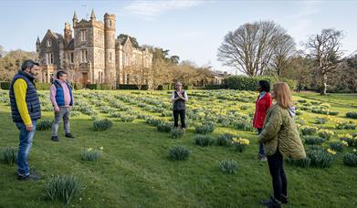 Group standing outside with Elmfield Estate in the background enjoying the Journey into Stillness experience