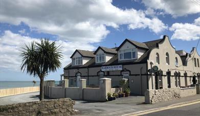 Exterior of the Harbour House Inn on a sunny day