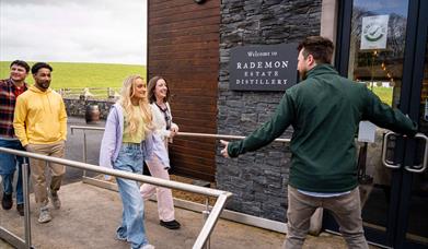 Group arrives at Rademon Estate Distillery and is welcomed by their guide