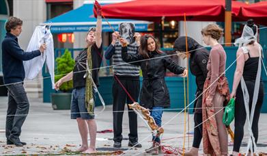 An image of performative artists outdoor
