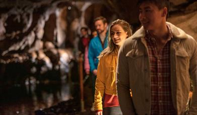 Tour group enjoys walking through the Marble Arch Cave underground experience