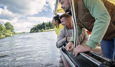 Guests admire the riverbanks from the river's perspective during the Best of the Bann experience