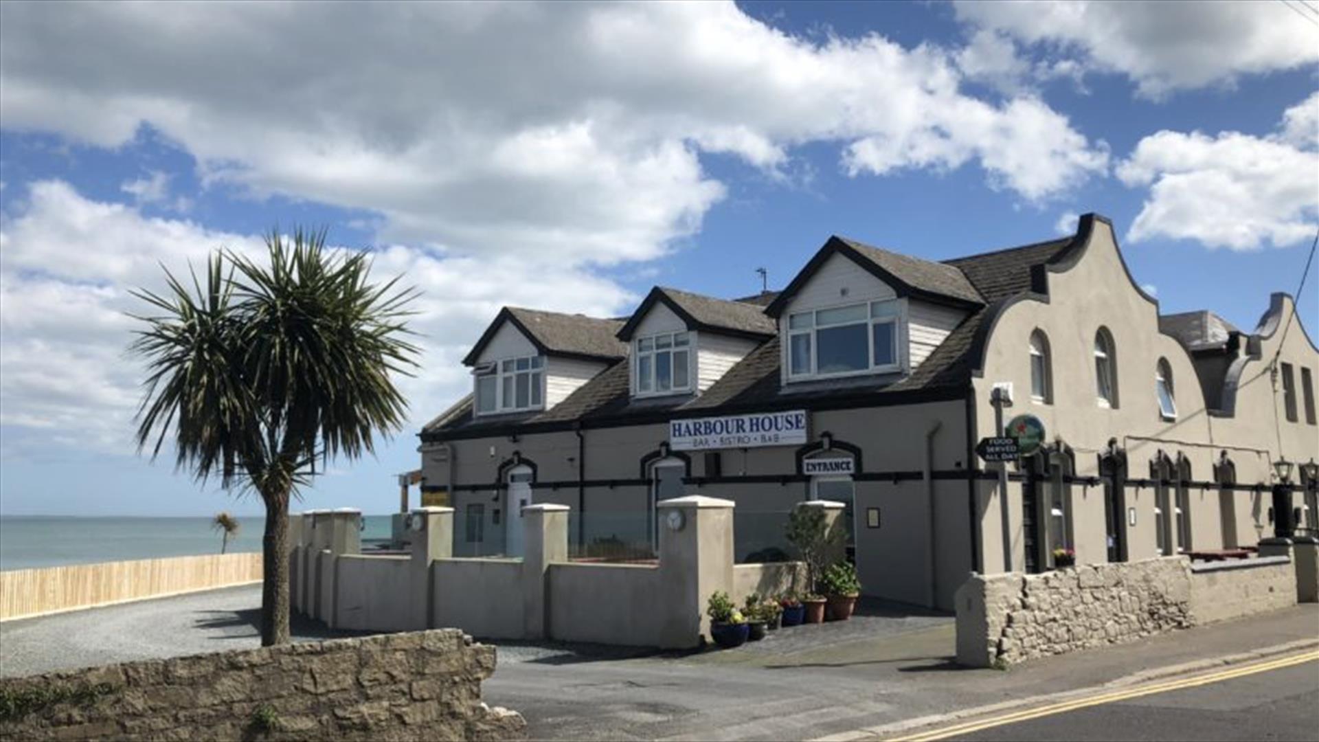 Exterior of the Harbour House Inn on a sunny day