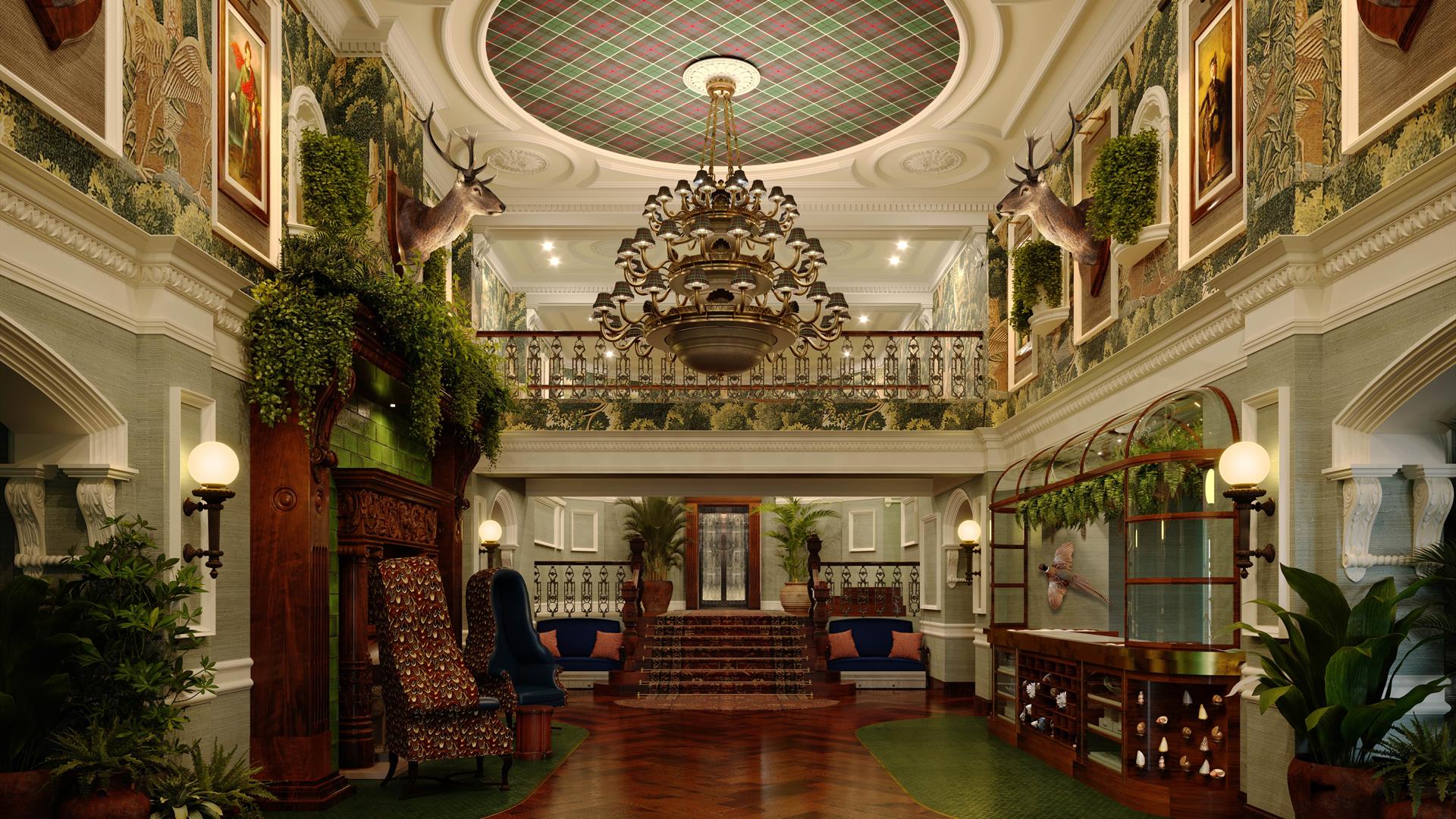 Grand lobby of Slieve Donard with dark wooden floors, lots of greenery and a large chandelier.