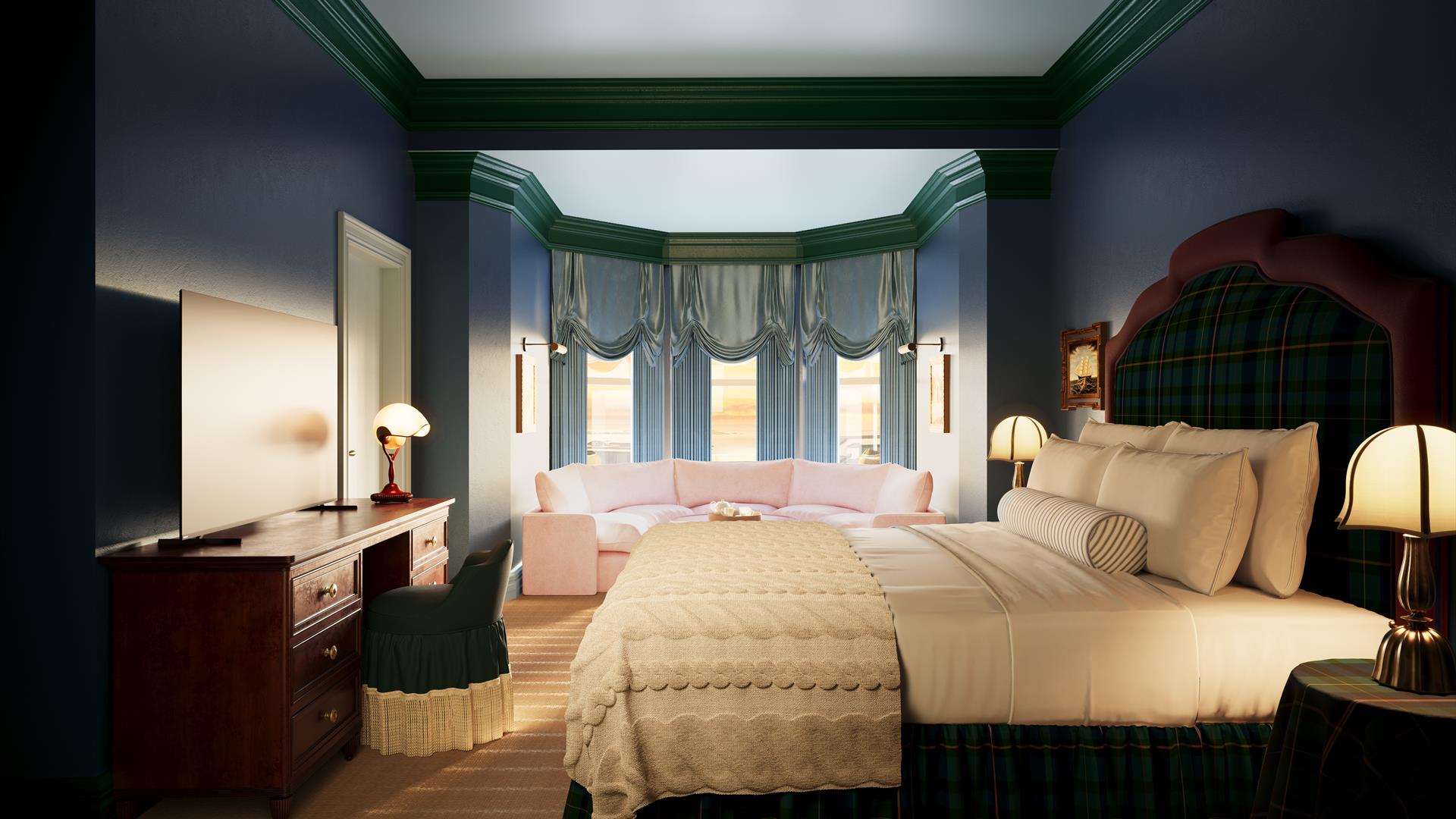 A new guest room at Portush Adelphi featuring two double beds, a coffee table and two armchairs.