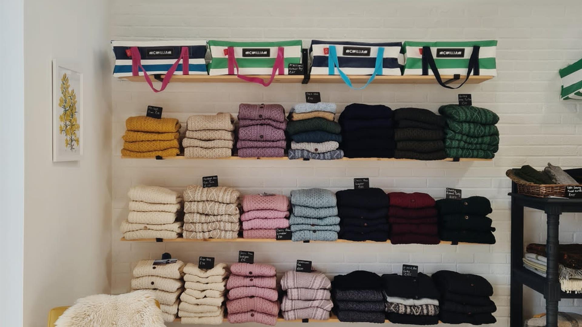 shelves at Bramble Green holding a range of colourful knitwear