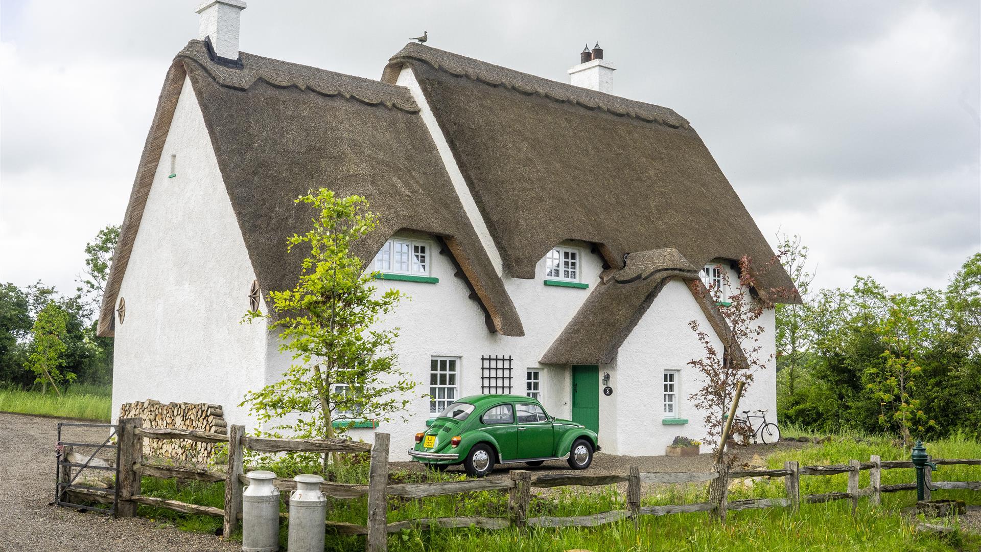 Outside view of Guest House with green car outside