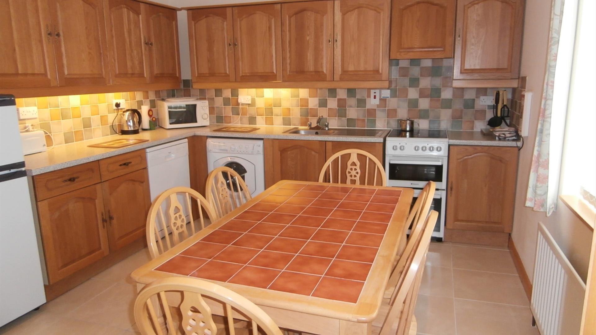 kitchen with dining table at No.6 - Strathroy Mews