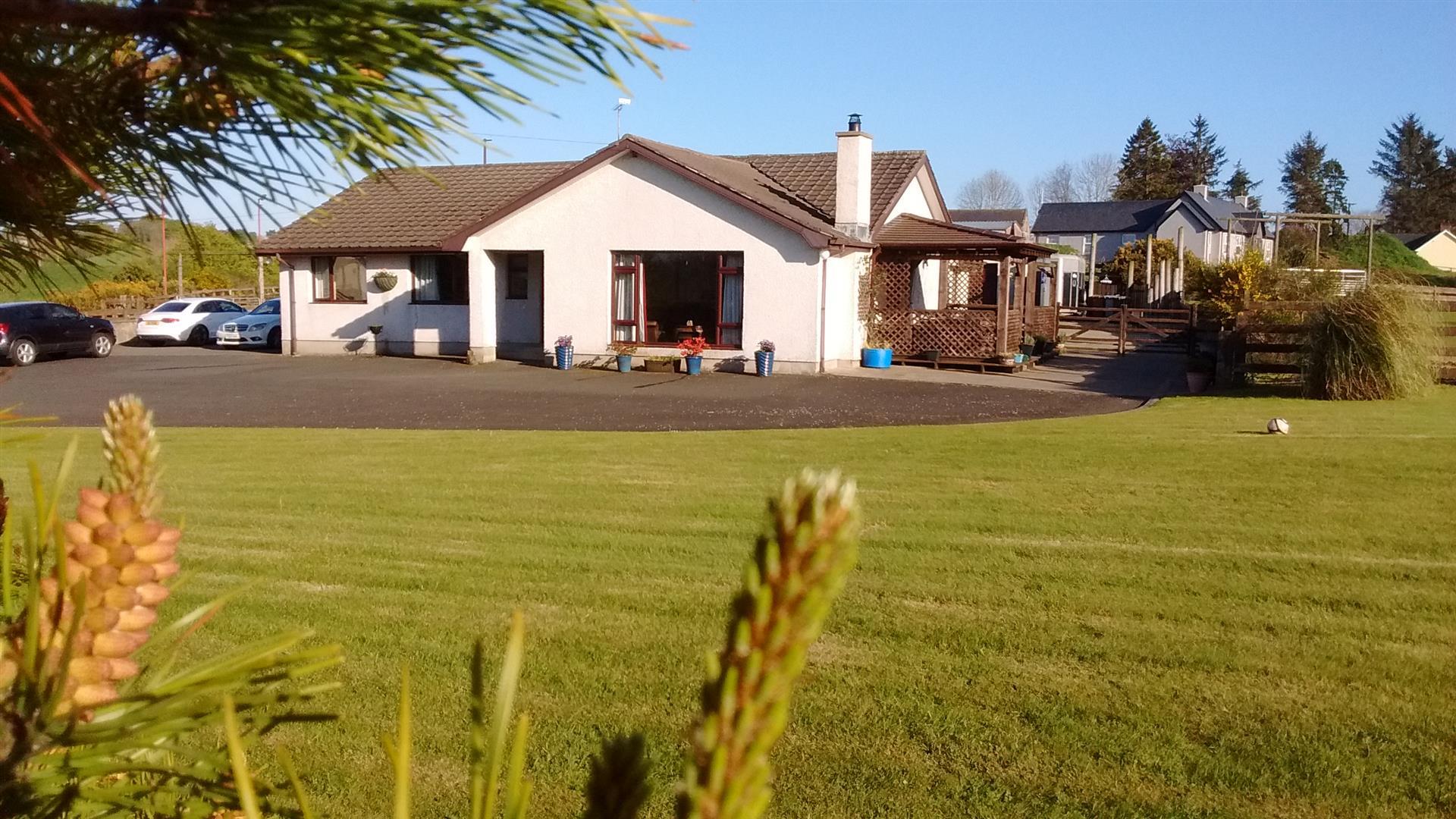 Outside view of house with large garden