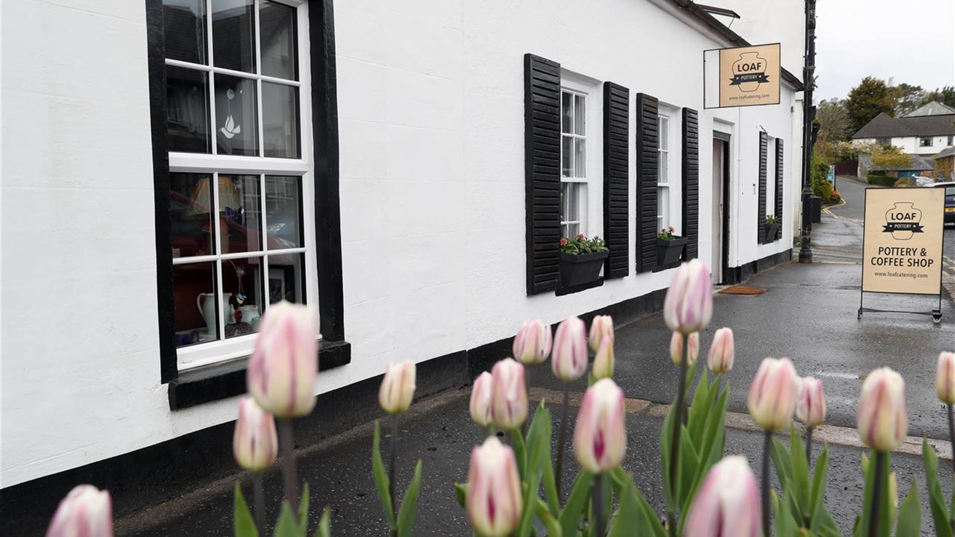 Front exterior to cafe with Tulips in the forefront