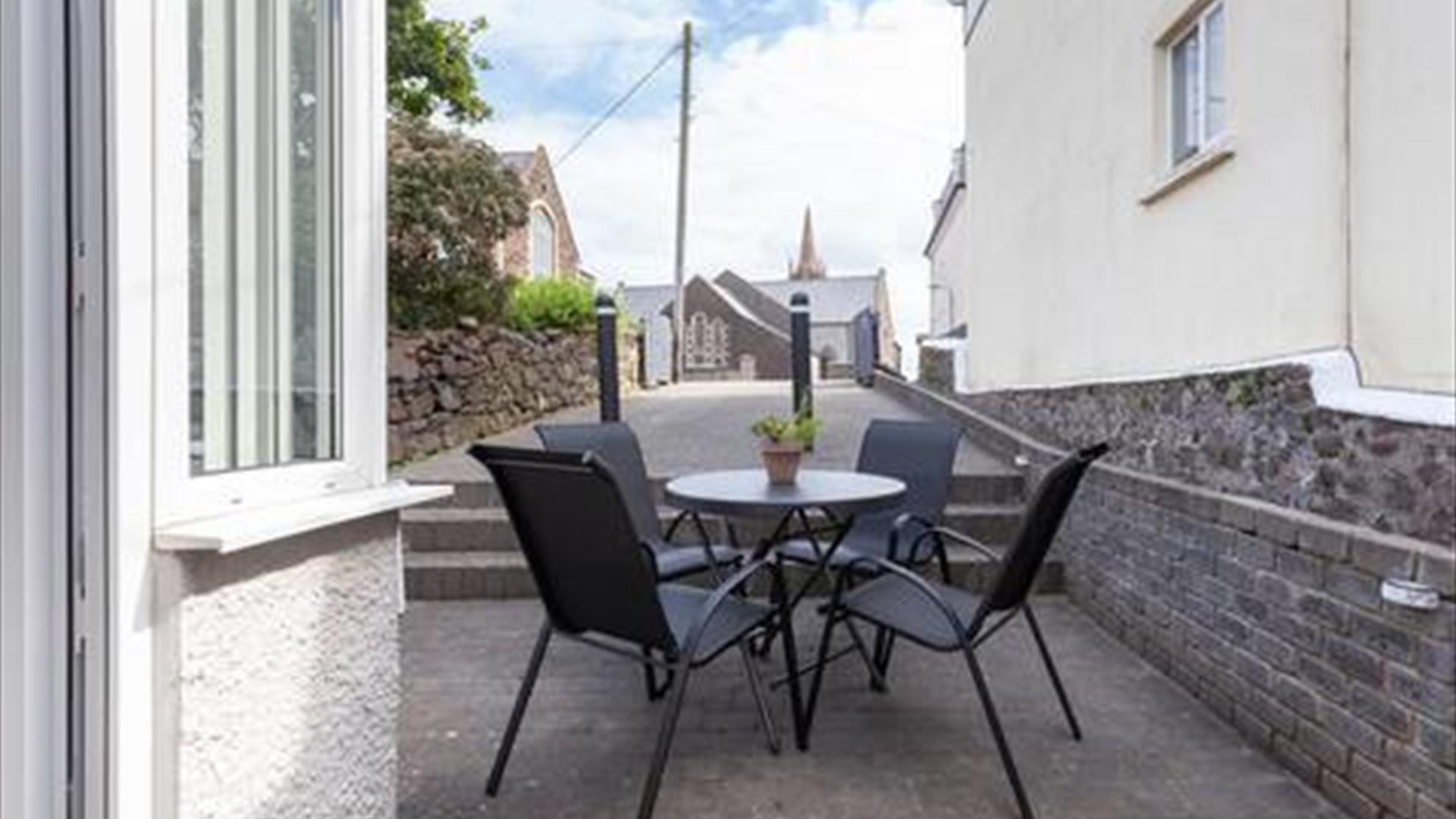 Outdoor patio area with furniture