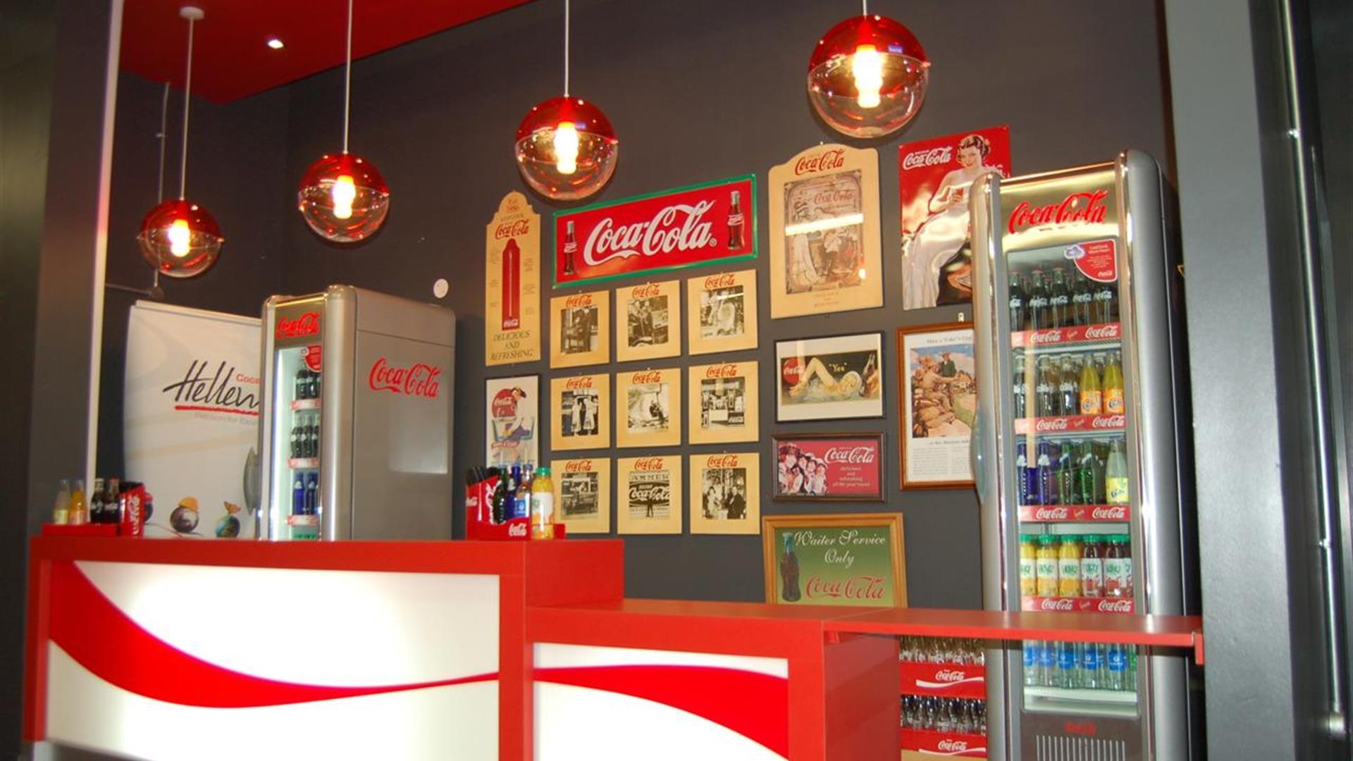 Image shows a drinks bar, fridge and counter top