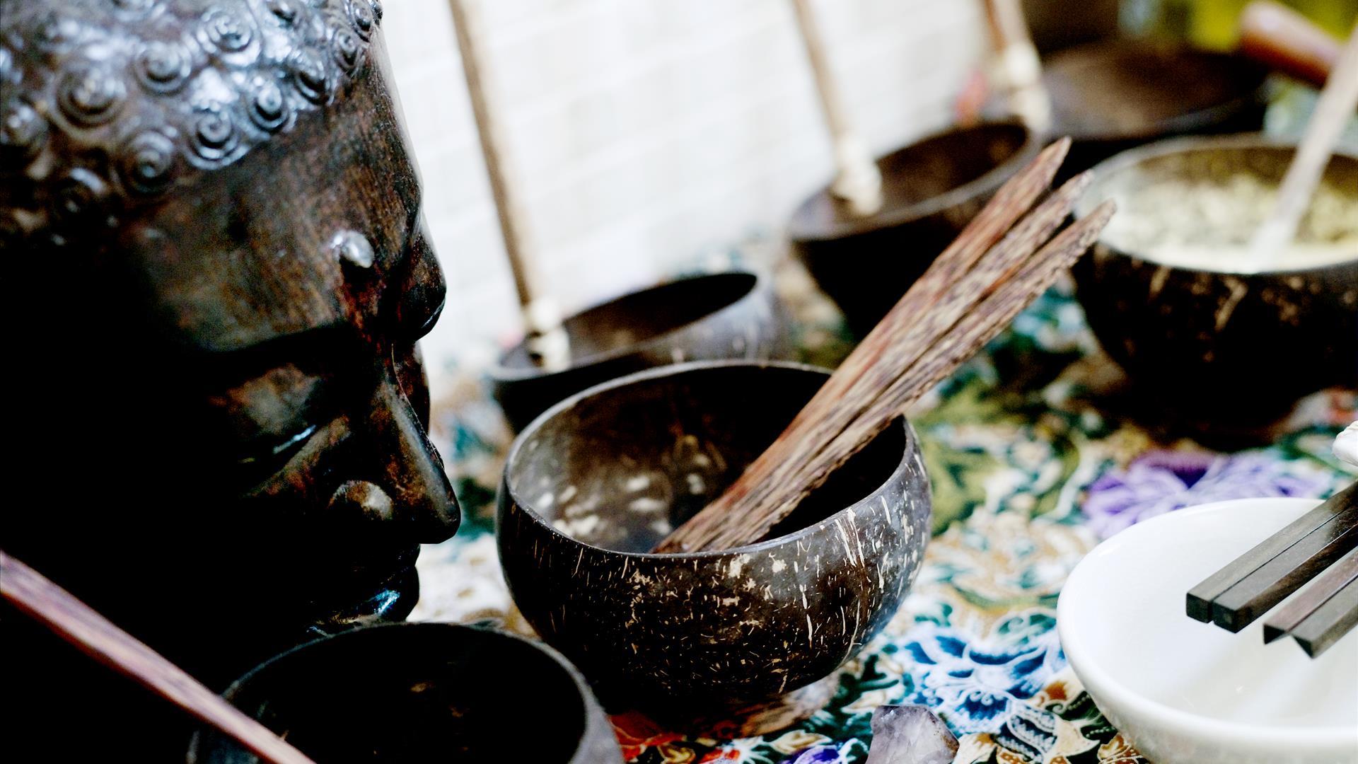 Statue and bowls with incense