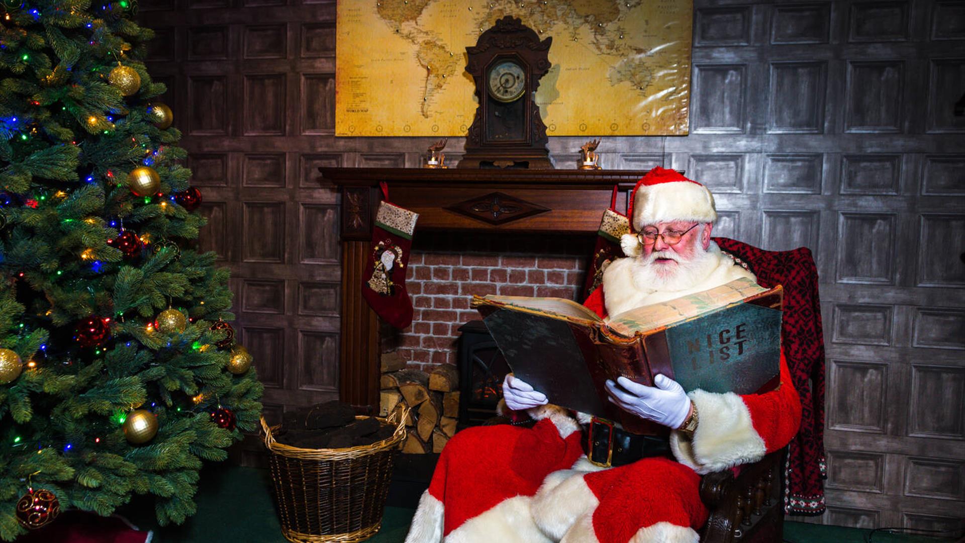 Father Christmas checking the Nice List