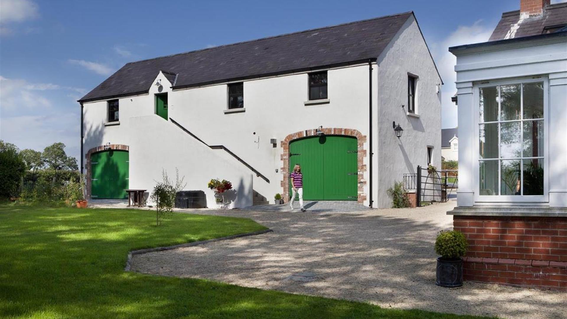 A lady walking outside the Barn at Lisnacurran