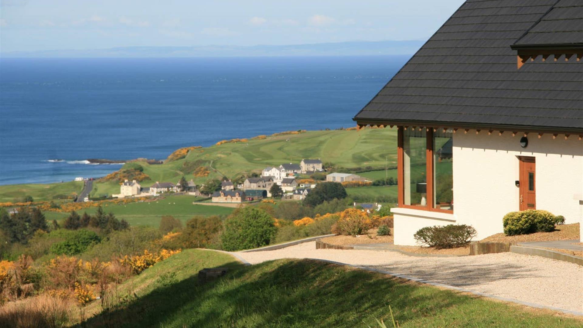 One of our lodges along with the view of the coast.