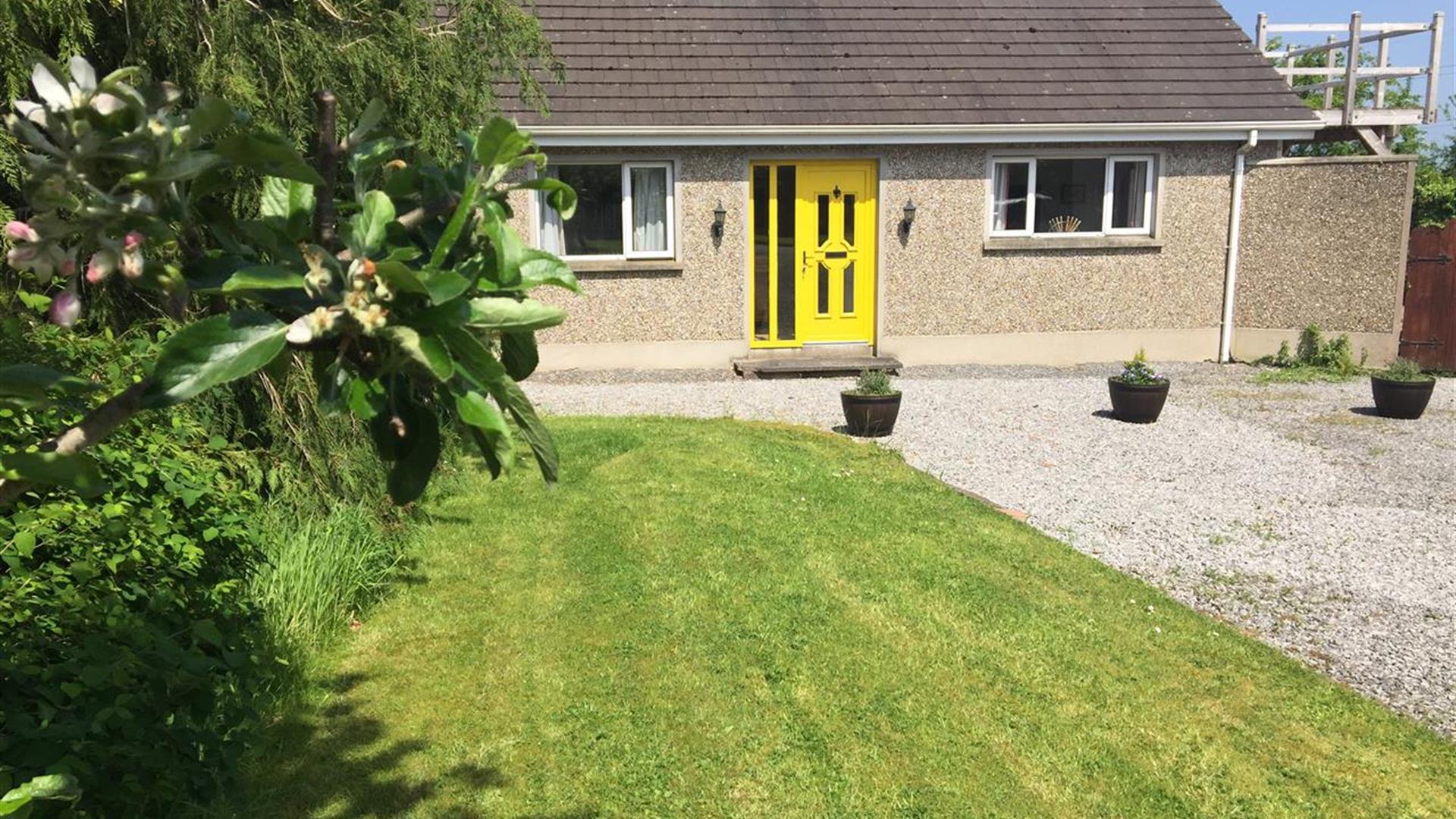 Outside image of house with yellow door