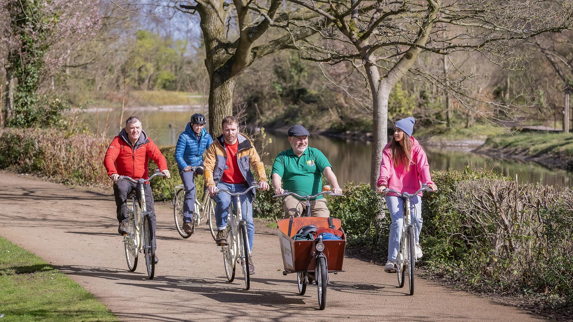 Steven from Hometown Tours guides 4 tourists along Belfast's beautiful riverside greenways as part of an urban bike tour