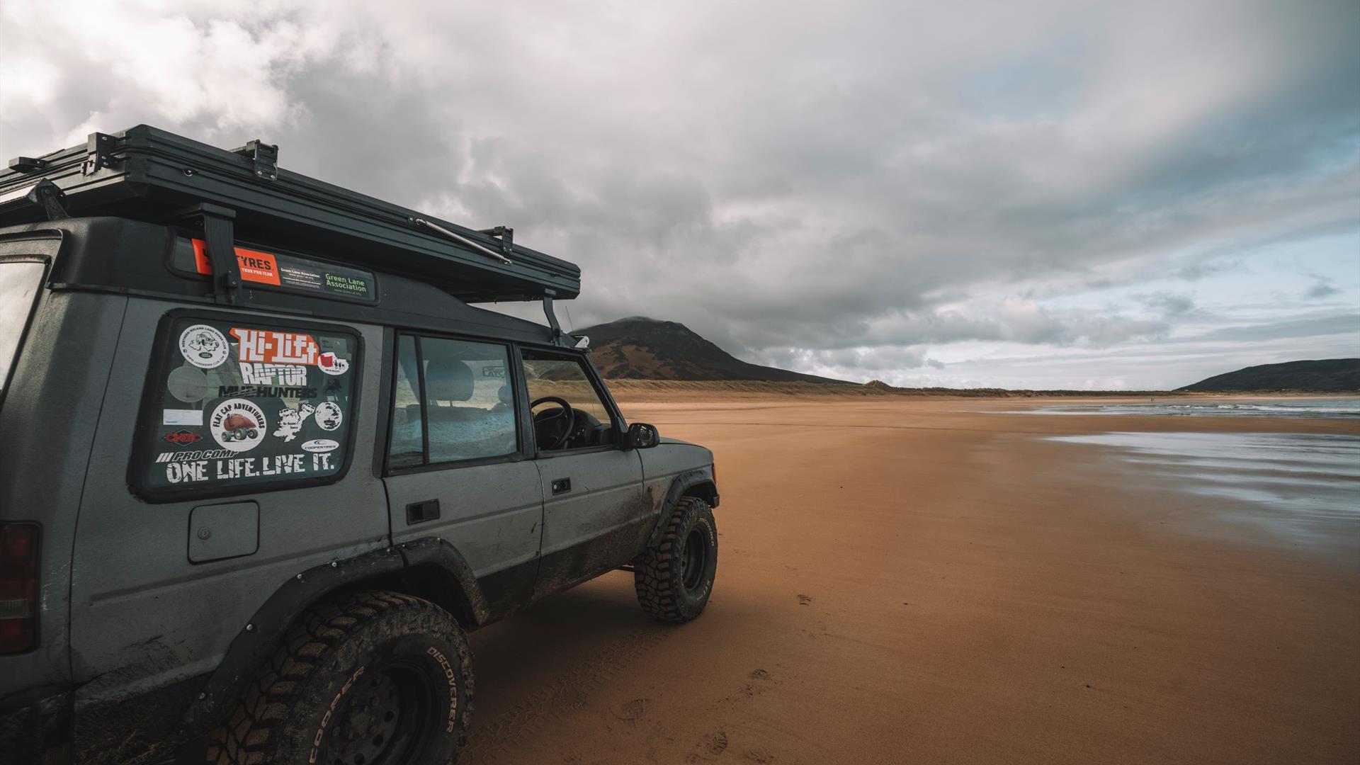 Land Rover Parked on Beach