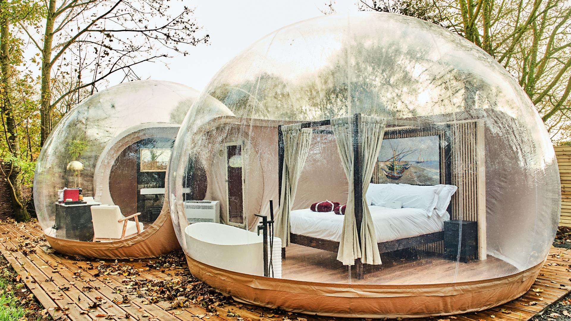 Premium bubble dome featuring a four posted bed and bath