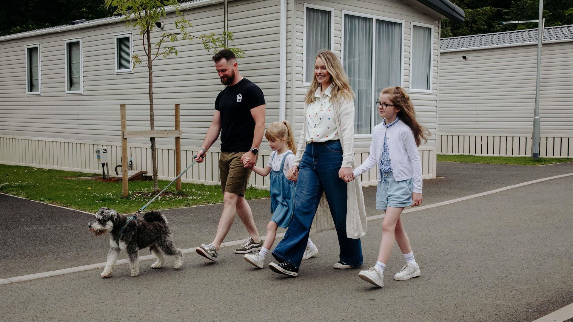family walking dog