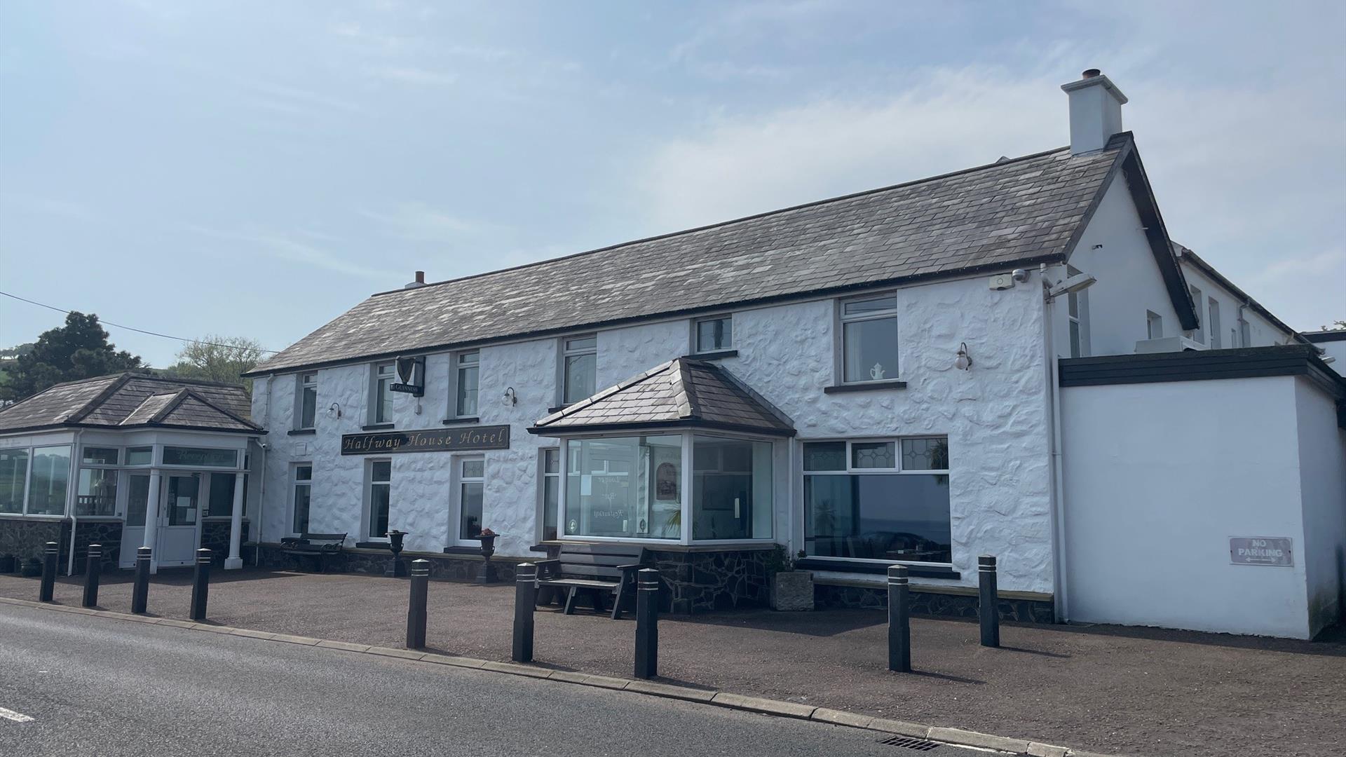 Whitewashed wall exterior of Halfway House Hotel in Ballygally