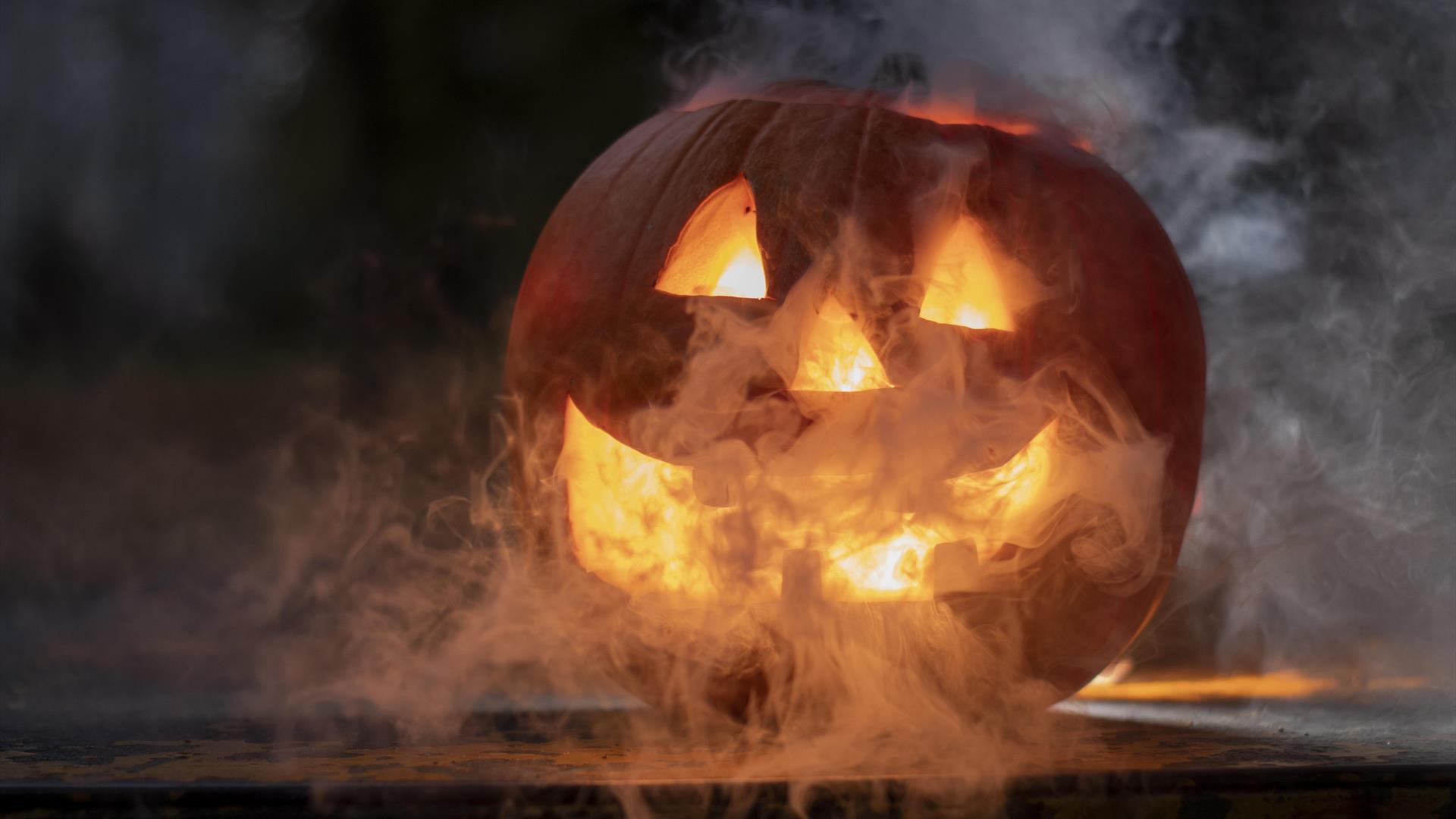 Halloween Pumpkin pumpkin lit up in a smoky atmosphere