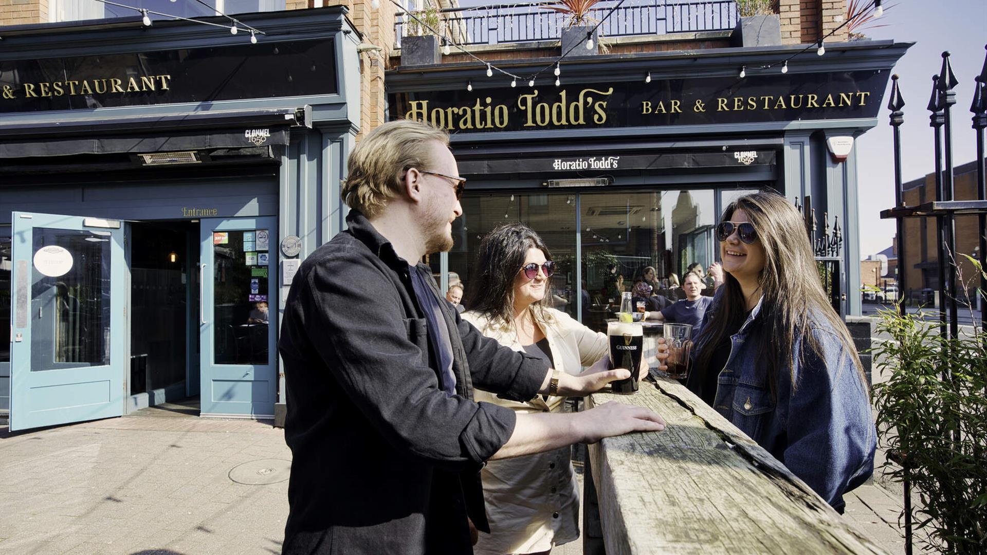 Group sitting outside Horatio Todd's having a drink and chatting