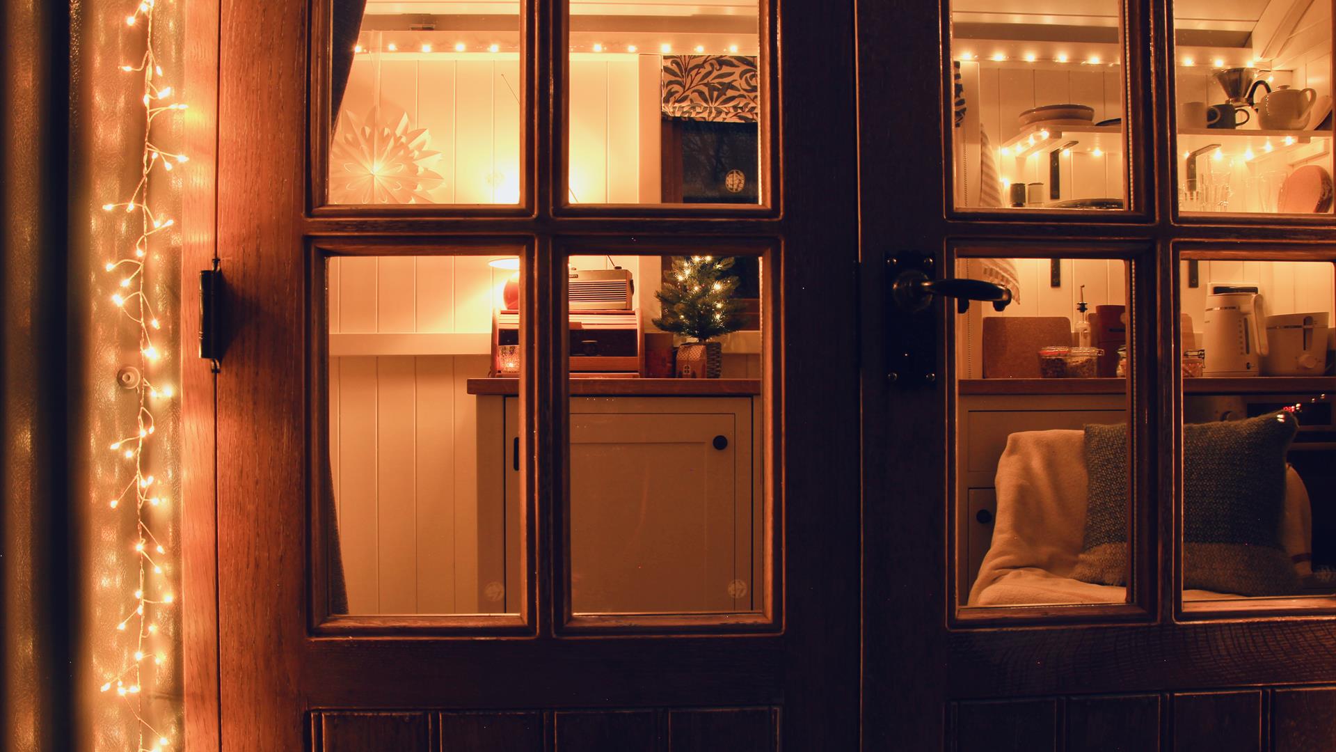 Peatlands shepherd hut doors with festive decoration.