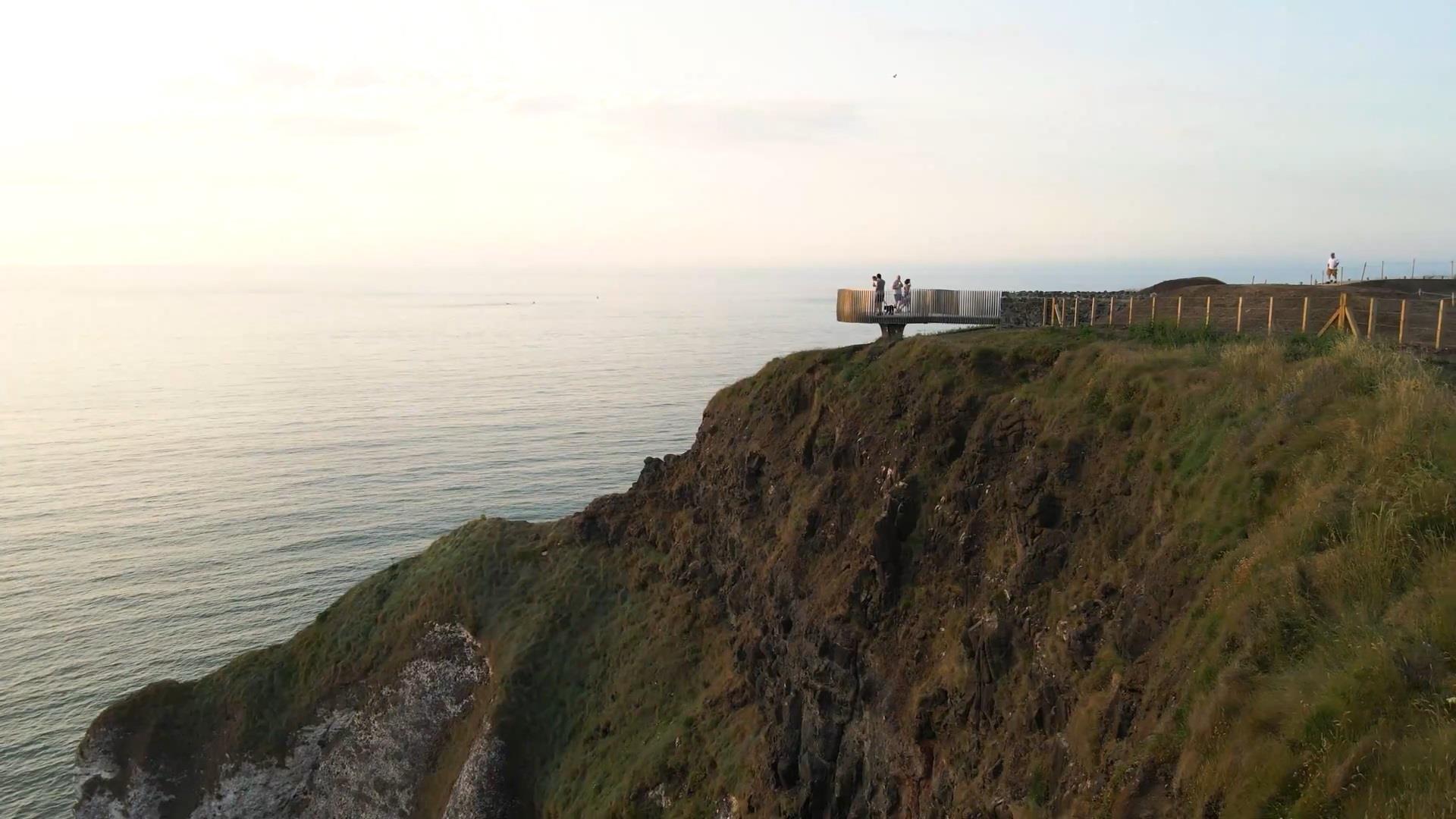 people standing on the viewing platform at Magheracross viewpoint