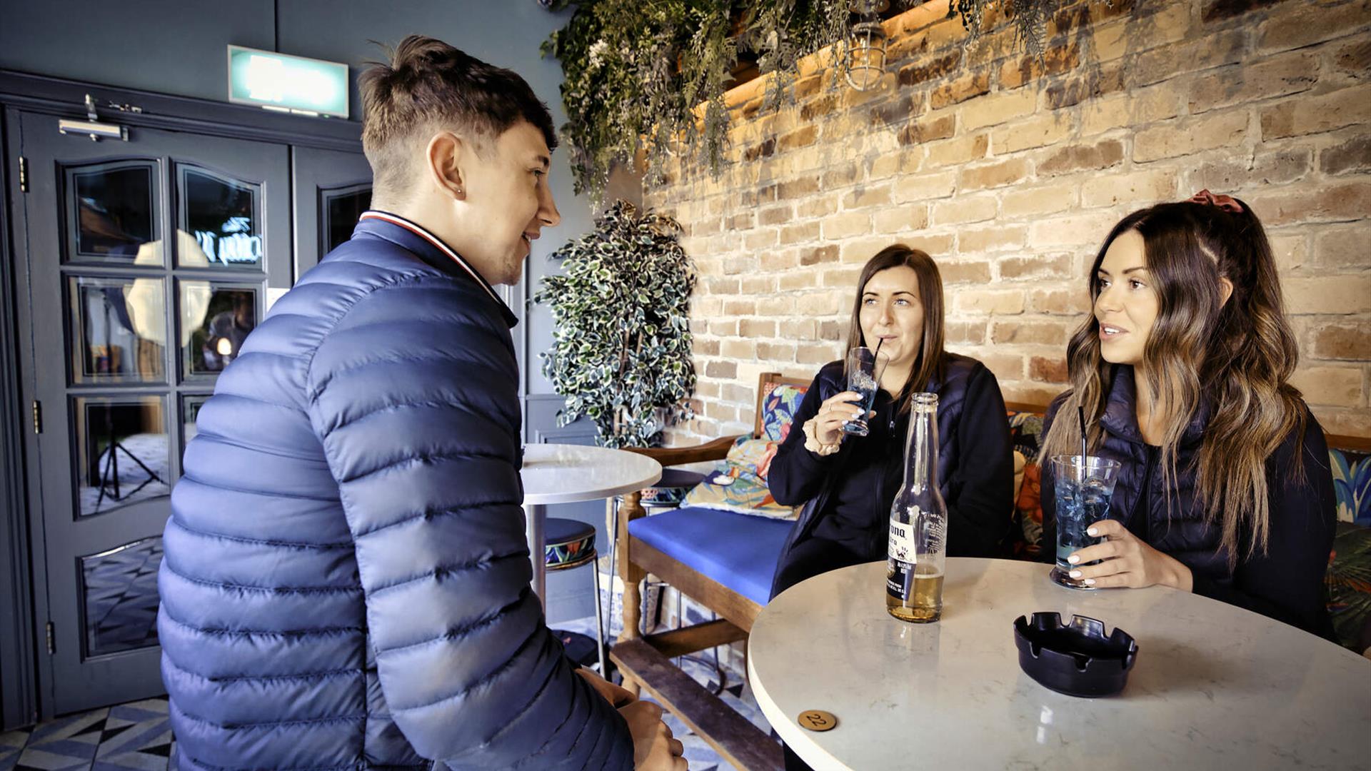Group of friends at in garden area McAleers Bar