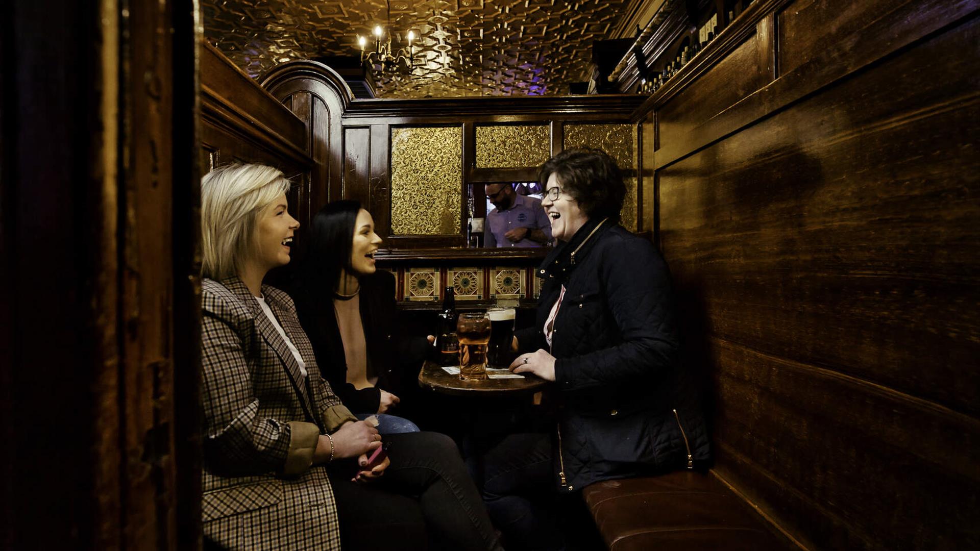 Group of friends around table at McConville's Bar Portadown