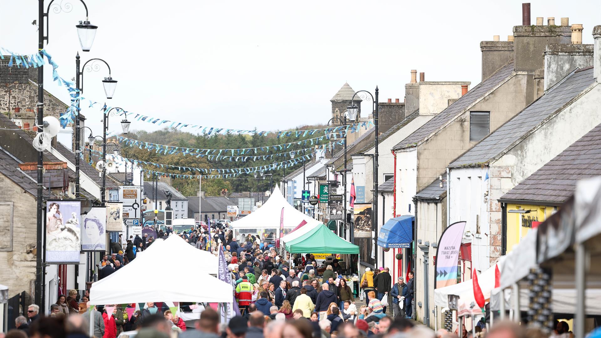 Crowds and stalls fill the main street in Bushmills