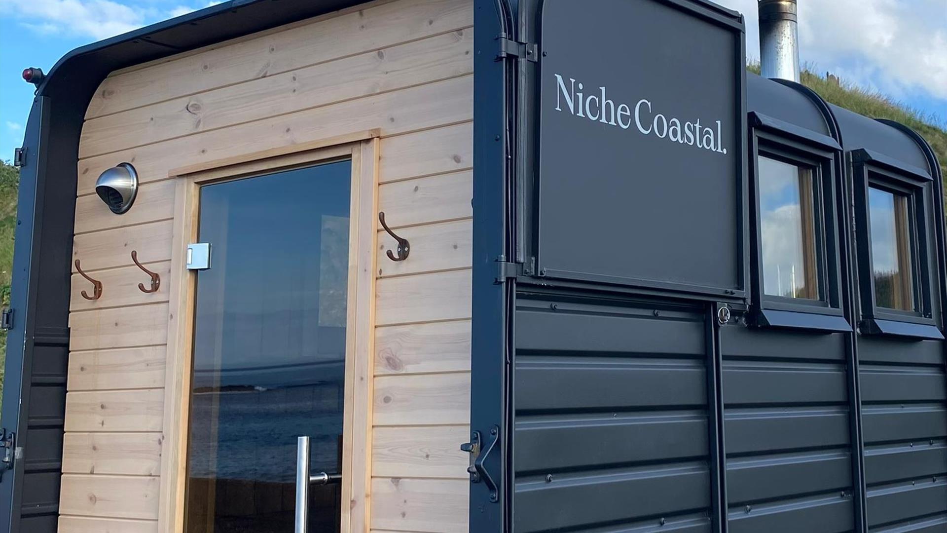 Close up of the back of the sauna, with the horsebox door open.