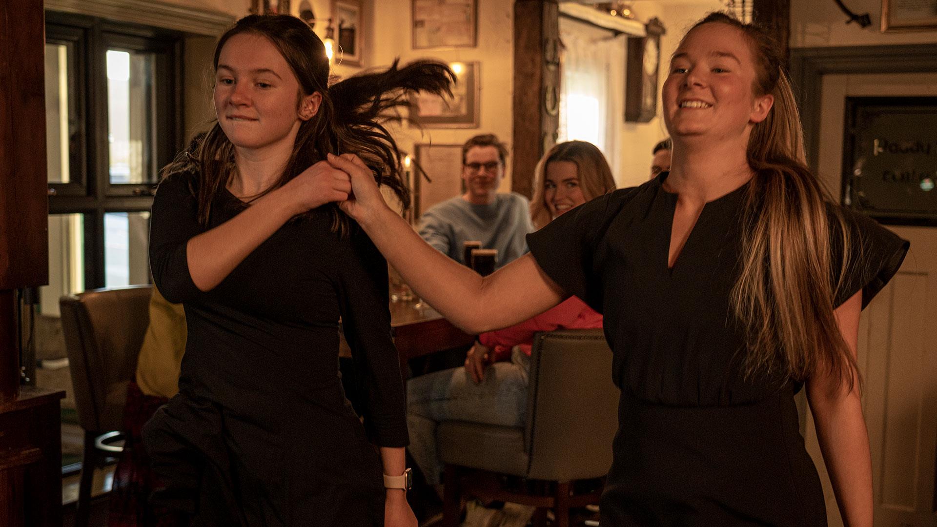 Two dancers doing a demonstration as part of the Ceili & Craic experience at The Ponderosa.