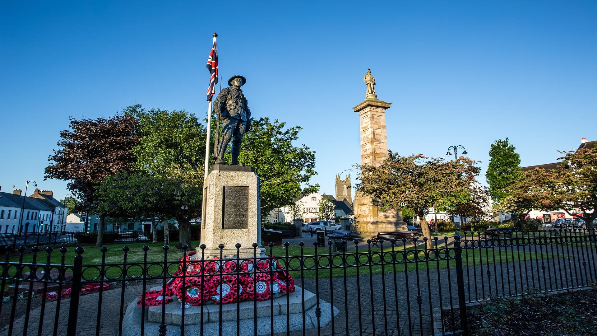 Photo of the Rollo Gillespie Monument standing tall in the centre of Comber Square