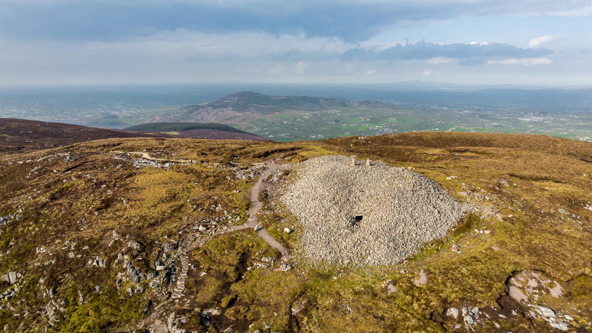 Birds eye view showing Slieve Gullion Cairn from top and surrounding landscape in the background.