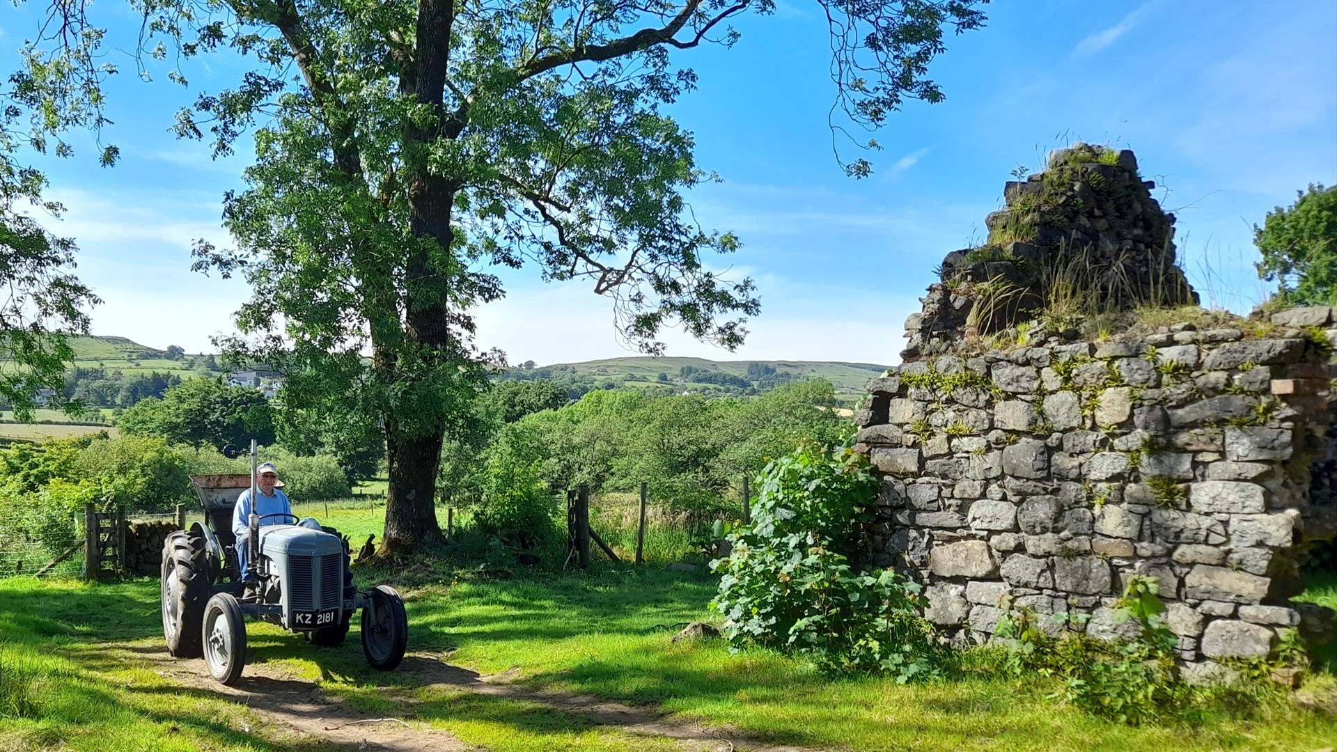 Ferguson Tractor in front of old farm building