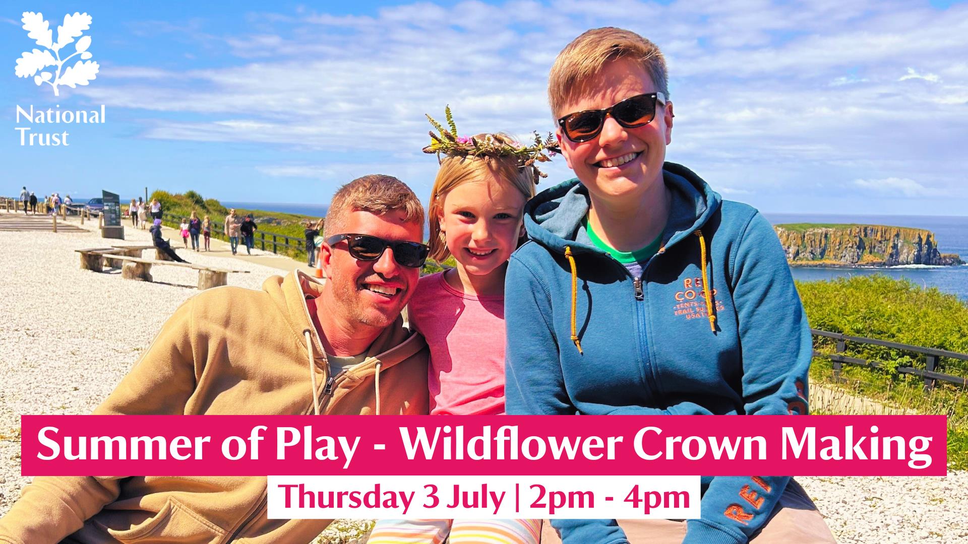 A family pictured enjoying a Wildflower Crown Making session on a sunny day at Carrick-a-Rede