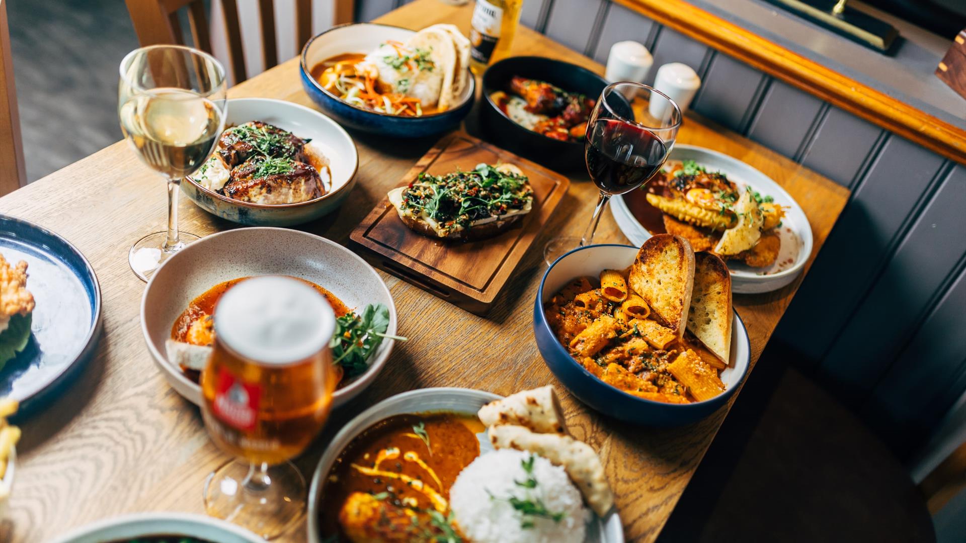 Plates of food and drinks on a table