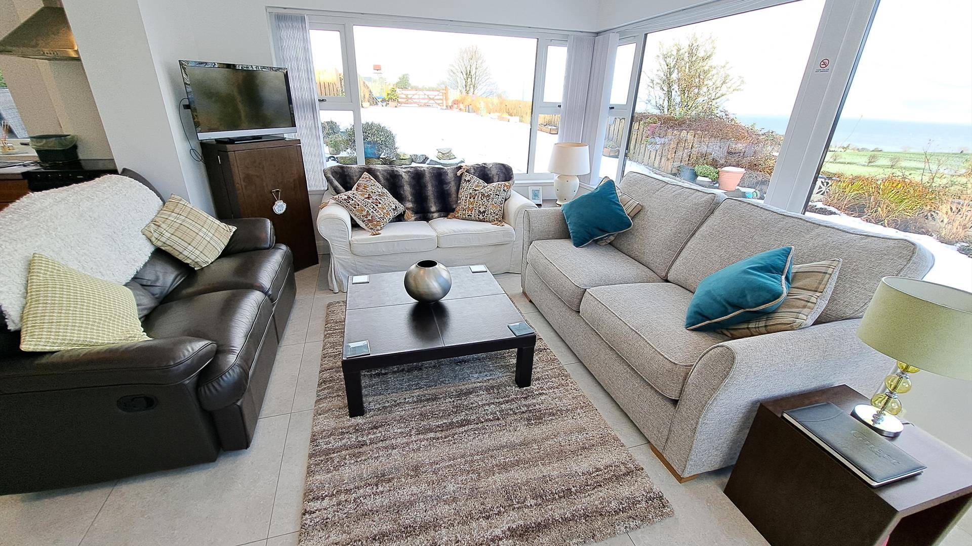 Sitting room area with surround windows and beautiful views.