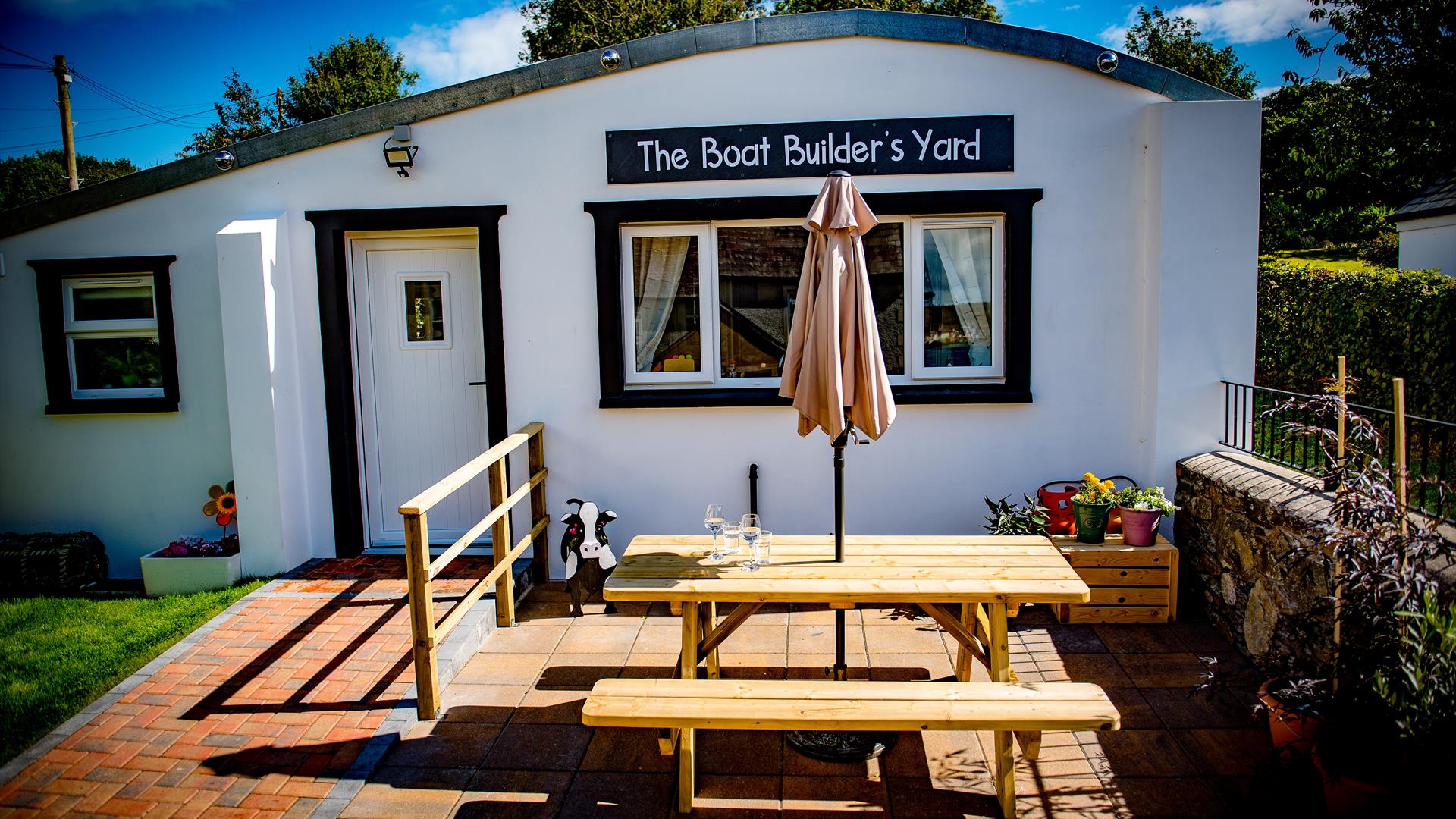 The Boat Builder’s Yard, Portaferry with Summer table and bench outside.