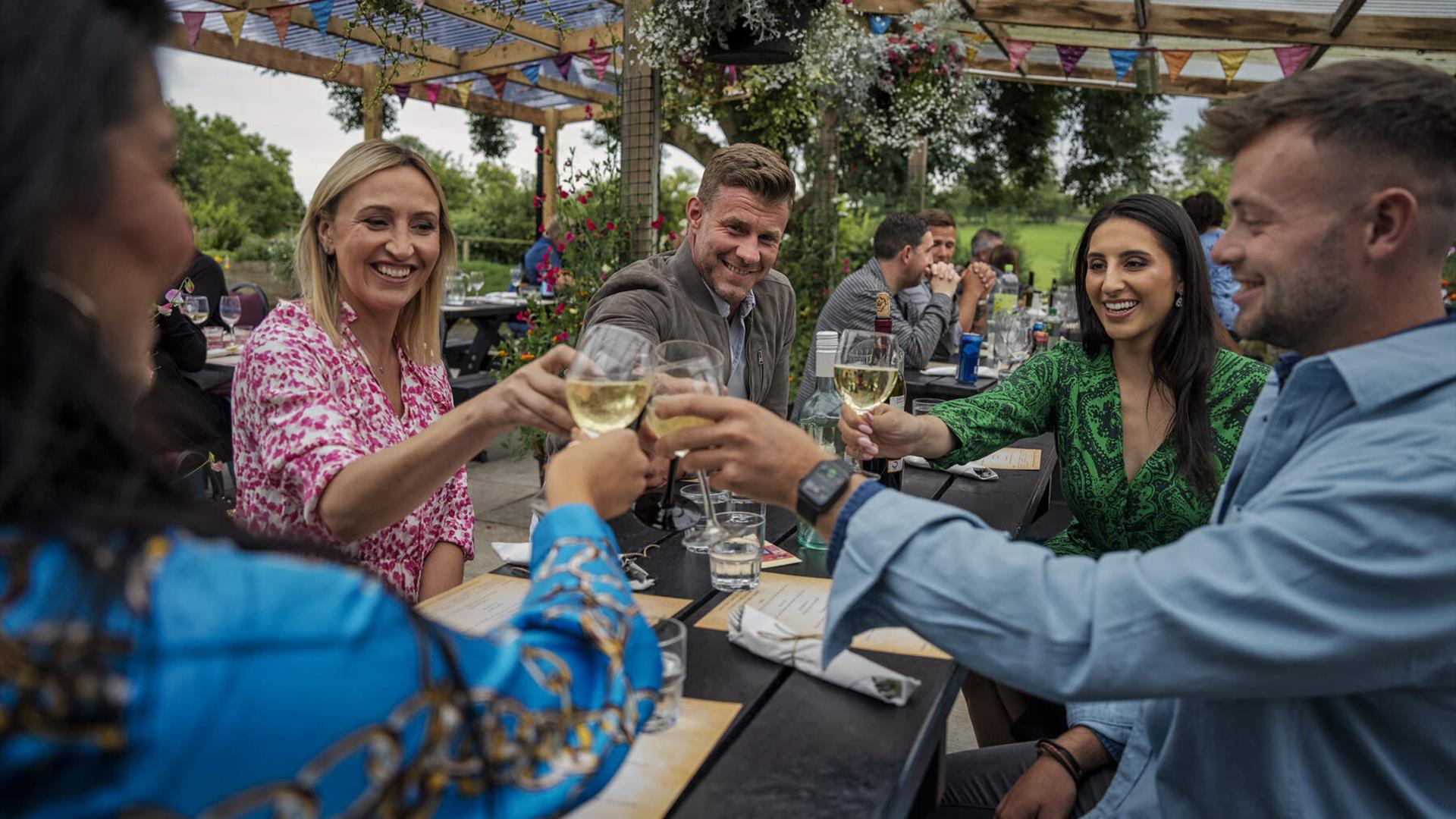 Guests cheers their drinks as they settle in for an evening of locally cooked produce at the Slemish Supper Club