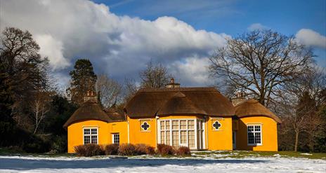 Image credit: Alan Hopps
Derrymore house. A bright yellow cottage with a thatched roof.