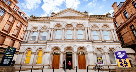 An image showing the exterior of an old bank converted into a creative space.