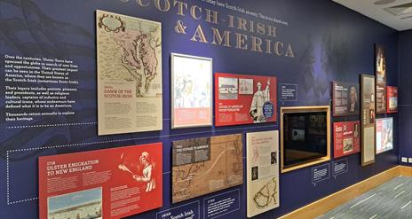 Informative exhibit wall showcasing the history of the Ulster-Scots/Scotch-Irish in America. The information features maps, text panels, and images of